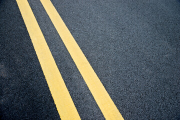 Fototapeta Double yellow lines on asphalt road obraz