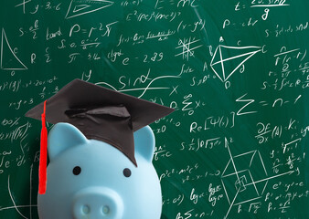 piggy bank in front of chalk board