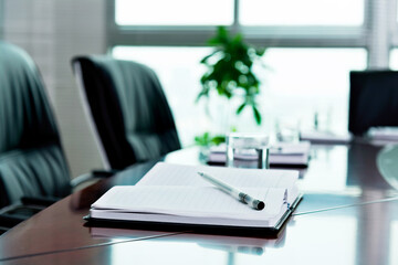 Notebook with pen in the meeting room