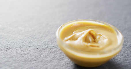 Image of close up of peanut butter on gray background