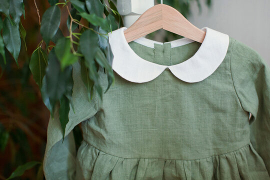 Green Dress In Hanger At Store