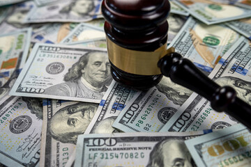 Gavel cash dollar bills and financial crimes.