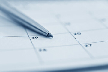 Closeup of pen on calendar