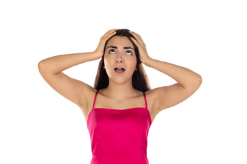 Obraz premium Worried and surprised young girl with dark hair and wearing a pink top