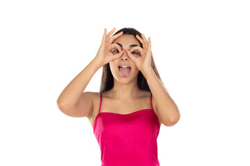 Young brunette woman looking through her fingers as they were glasses