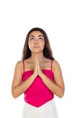 Brunette woman standing with praying hands