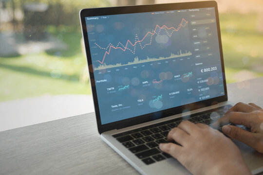 Business people using Laptop with various type of financial and investment products in Bond market. i.e. Crypto Currency, bonds, stocks. Sustainable portfolio management.