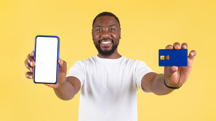 Black Male Showing Big Phone And Credit Card Shopping, Studio