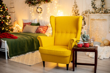Empty yellow armchair in a decorated room for Christmas