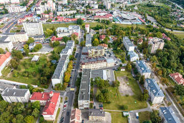 aerial panoramic view from great height on red roofs of historical center of old big city