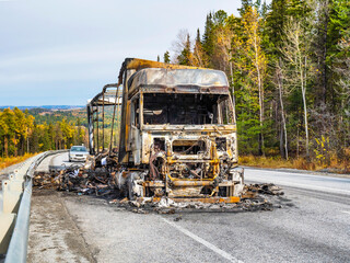 A burnt-out van after a road accident. Consequences of an engine fire. An insurance case.