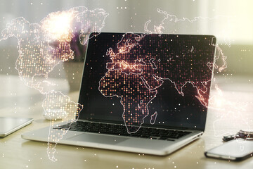 Multi exposure of abstract creative digital world map on modern laptop background, tourism and traveling concept