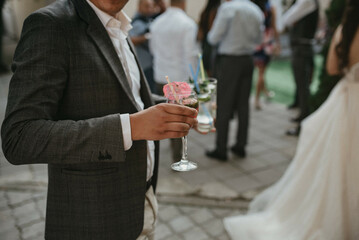 Handsome man drinking exotic cocktail.