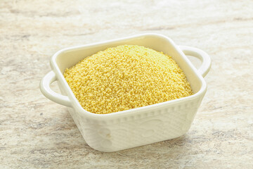 Raw couscous in the bowl