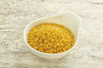 Raw bulgur in the bowl