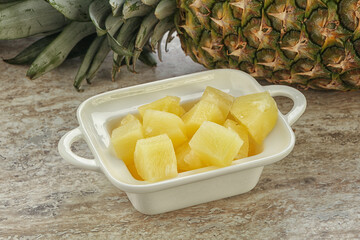 Marinated pineapple slices in the bowl