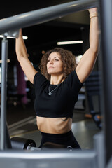 Sportswoman works out in the gym