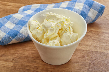 Italian soft mascarpone cheese in the bowl