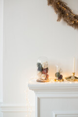 Christmas decor on a white fireplace