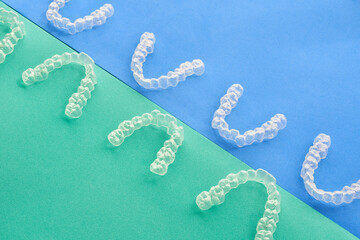  Transparent, invisible dental aligners or braces applicable to orthodontic treatment are placed on...