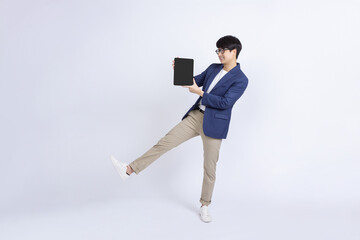 Smiling cheerful Asian man show tablet computer screen isolated on white background