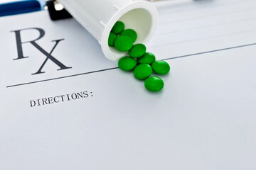 Medicine bottle and pills on prescription