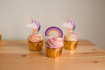 Baking cupcakes with unicorn topper