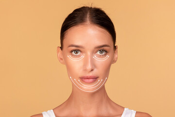 Plastic surgery woman face. Young lady with perforation lines on her face before plastic surgery...