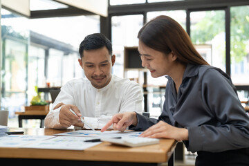 Asian business adviser meeting to analyze and discuss the situation on the financial report in the meeting room.Investment Consultant, Financial advisor and accounting concept