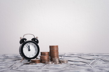 Clock with Coins money on money bank table growth saving money with take time, Concept financial...