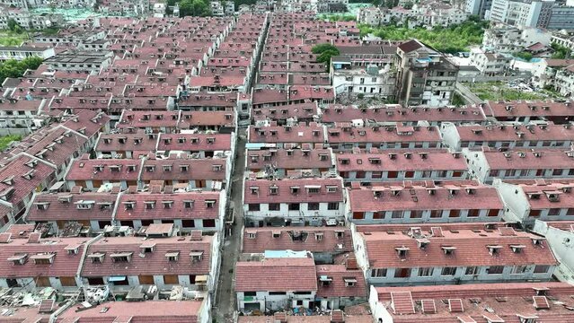 The traditional buildings waiting for demolition. Drone aerial view. The traditional Shikumen buildings waiting for tearing down.  Real estate, economy, business concept b-roll footage.