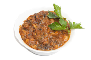 Lobio with beans. Traditional Georgian homemade food. Boiled beans in tomato sauce with parsley