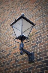 ornate lantern on side wall of building. decorative vintage style street light 