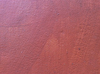 Texture concrete painted with red paint