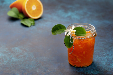 orange jam in a glass jar - 533323036