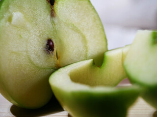Slied green apples sliced with peel macro