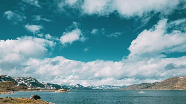 Oppland, Tyin Lake, Norway. Stones On Coast Of Beautiful Lake Tyin In Summer Day. Norwegian Nature. 4K.