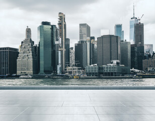 Empty concrete seafront on the background of a beautiful Manhattan city skyline at sunrise, mockup