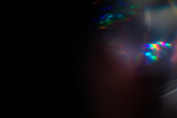 Blur colorful rainbow crystal light leaks on black background. Defocused abstract multicolored retro film lens flare bokeh analog photo overlay or screen filter effect. Glow Vintage prism colors