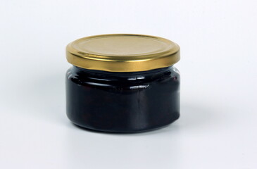 Small glass jars with dark fruit jam