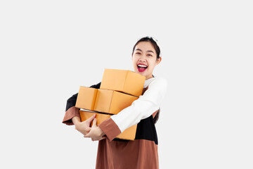 Online shopping delivery concept. Young asian girl holding and carrying brown boxes to shipping to her client of online selling business at home white background.