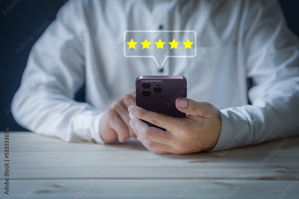 Poster man using a smartphone in give rating to service experience on application. online customer review s