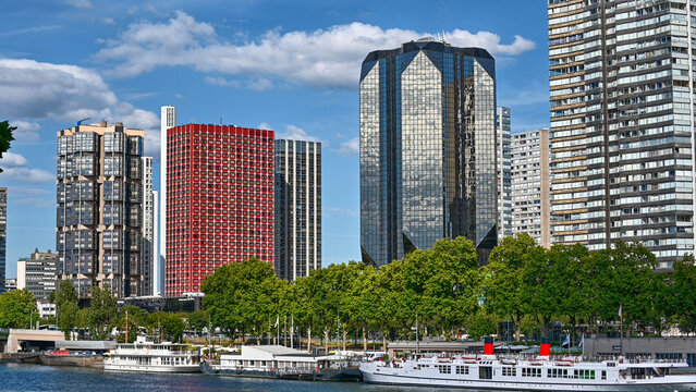 Paris, France, June 2022. A beautiful image with modern skyscrapers lined up along the Seine. Beautiful summer day.