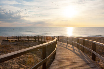 Fototapeta na wymiar Sunrise Beach Boardwalk with Dunes and Sea Oats 