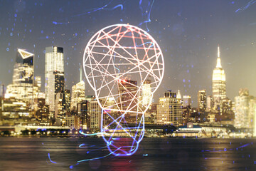 Double exposure of creative light bulb hologram on New York city skyscrapers background, research...