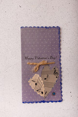 14 February Valentines day grey blue postcard with two notes paper hearts on white background
