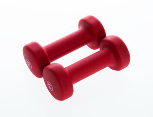 Pair of red dumbbells isolated on white