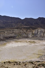 A view of the active hydrothermal crater of Stefanos volcano on the Greek island of Nisyros on a summer holiday day.