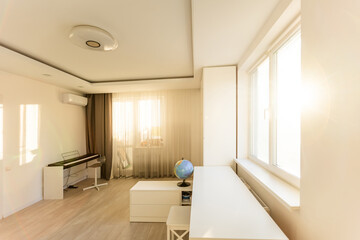 Stylish composition of cozy scandinavian child's room interior with wooden bed, toys and hanging decorations. Creative wall.