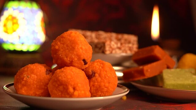 Peanut chikki candy gajak, Laddu, Indian sweet foods specially made for festivals of India like Diwali, Dussehra, Holi, ganesh chaturthi, Ram navami, Durga pooja, durga ashtami, Navratri.